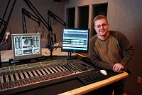 Way Media's Jon Garrison shows off an Axia Element console at WAY's Nashville studios.