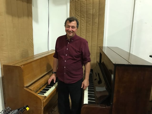 Frank between pianos used for the Beatles' “Get Back” and John Lennon's “Imagine”