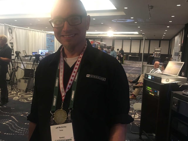 Jeff shows off his medal