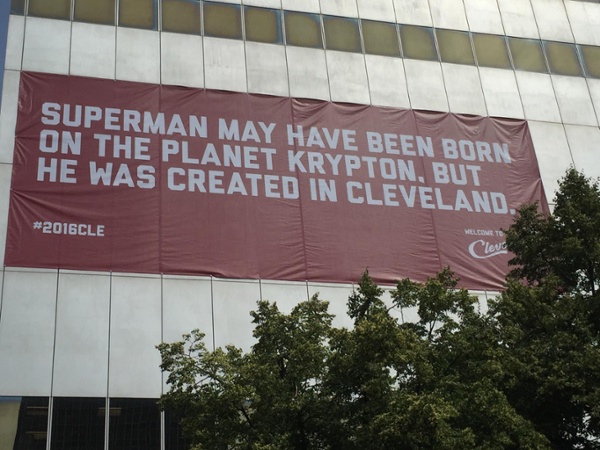 Superman banner hangs from a downtown building